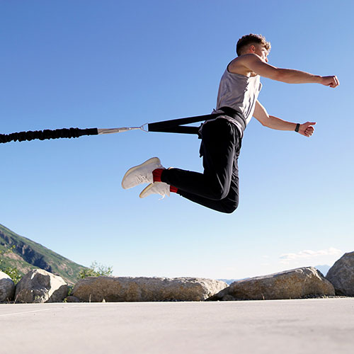 Stroops athlete doing Broad Jumps with Power Pull Belt