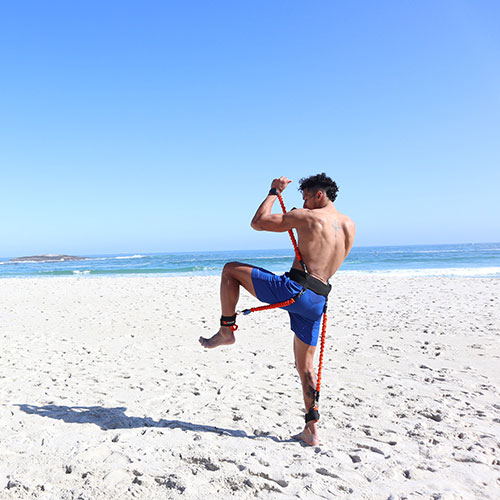 Stroops Athlete Training With Striker on the Beach